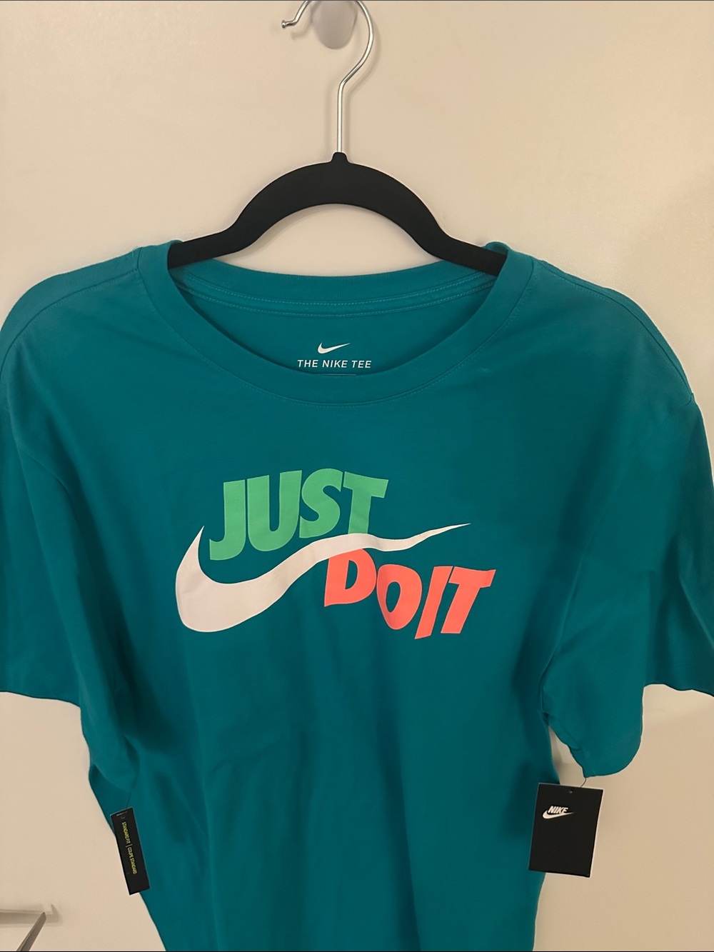 Nike Teal 'Just Do It' Graphic Tee with White Swoosh and Multicolor Text